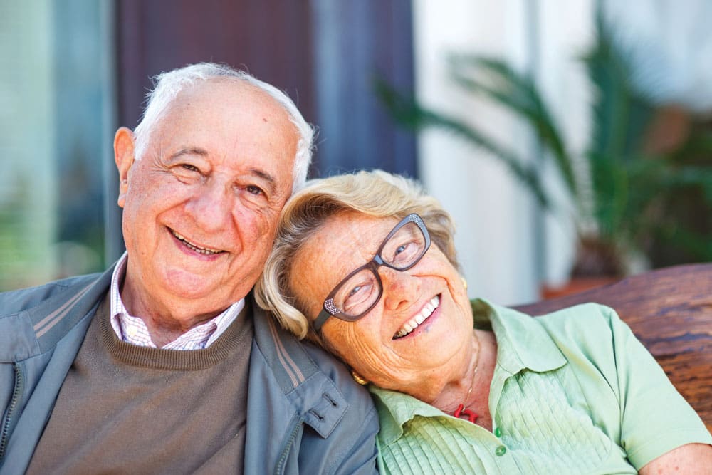Happy senior couple relaxing and enjoying retirement living at Walking Horse Meadows, Clarksville senior community.