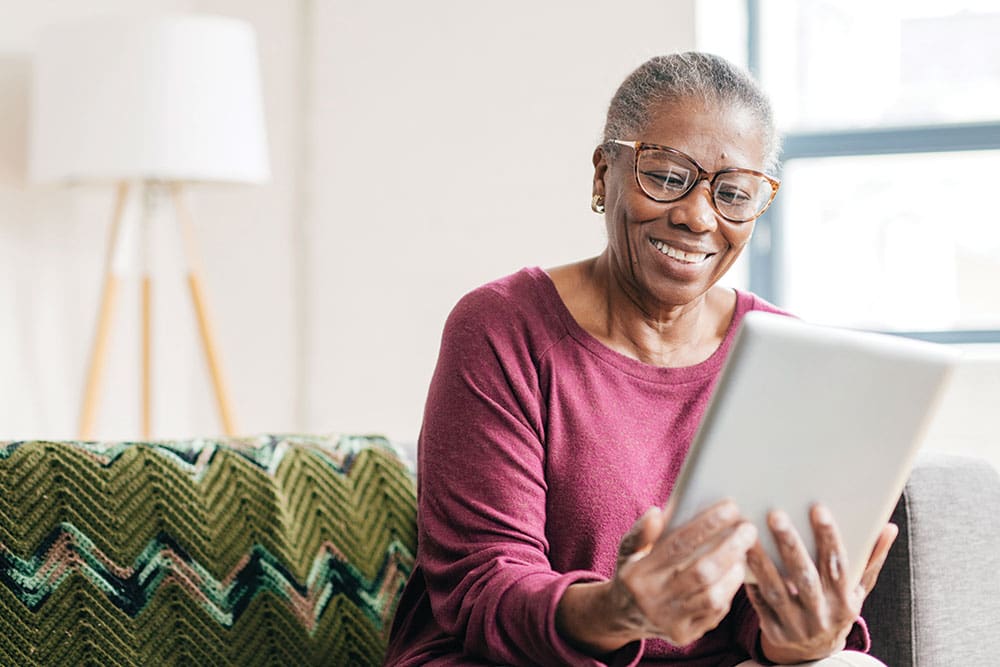 Senior resident using technology and enjoying leisure activities at Walking Horse Meadows Senior Living in Clarksville, TN.