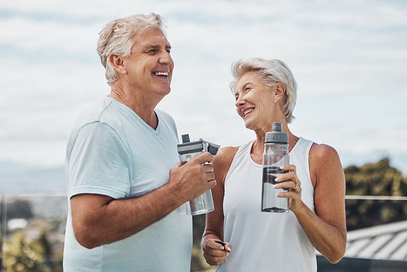 Senior couple enjoying outdoor exercise and wellness activities at Walking Horse Meadows in Clarksville, Tennessee.