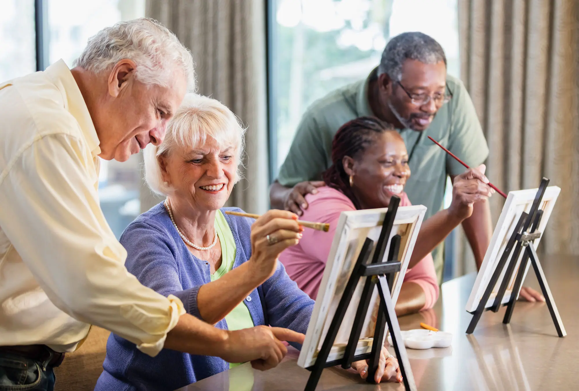 Senior residents participating in engaging painting activities at Walking Horse Meadows Senior Community in Clarksville, TN.